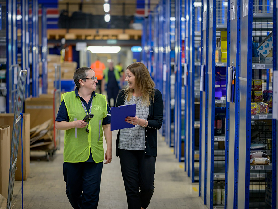 Logistics team coordinating shipments in a warehouse
